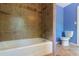 Bathroom featuring tiled shower and toilet at 2738 Westminister Nw Ln, Conyers, GA 30012