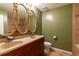 Bathroom with dual sinks and large mirrors at 2738 Westminister Nw Ln, Conyers, GA 30012