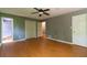 Bedroom with wood floors and multiple entry doors at 2738 Westminister Nw Ln, Conyers, GA 30012