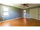 Bedroom featuring hardwood floors, closet, and natural light at 2738 Westminister Nw Ln, Conyers, GA 30012