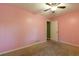 Bedroom with ceiling fan and carpet at 2738 Westminister Nw Ln, Conyers, GA 30012