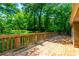 Spacious wooden deck provides a peaceful view of the surrounding greenery at 2738 Westminister Nw Ln, Conyers, GA 30012