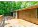 Large wooden deck features wood railings and scenic outdoor views at 2738 Westminister Nw Ln, Conyers, GA 30012