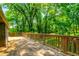 Spacious deck offers peaceful views of the surrounding lush greenery at 2738 Westminister Nw Ln, Conyers, GA 30012