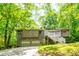 A unique home featuring a two-car garage, distinctive architectural elements and a quaint deck at 2738 Westminister Nw Ln, Conyers, GA 30012