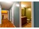 Hallway to a bathroom with cabinet and mirror at 2738 Westminister Nw Ln, Conyers, GA 30012