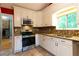 Stylish kitchen with stainless steel appliances, granite countertops, and mosaic backsplash at 2738 Westminister Nw Ln, Conyers, GA 30012