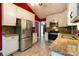 Well-equipped kitchen with stainless steel appliances, granite countertops, and tiled backsplash at 2738 Westminister Nw Ln, Conyers, GA 30012