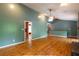 Spacious living room featuring hardwood floors, a ceiling fan, and neutral wall color at 2738 Westminister Nw Ln, Conyers, GA 30012