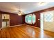 Living room featuring wood floors, unique windows, and a door leading outside at 2738 Westminister Nw Ln, Conyers, GA 30012