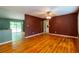 Living room with wood floors leading to the deck, painted walls, and a ceiling fan at 2738 Westminister Nw Ln, Conyers, GA 30012