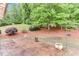 A sprawling backyard with a stamped concrete patio and green lawn, ideal for outdoor relaxation at 4460 Delano Dr, Cumming, GA 30040