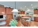 Modern kitchen with stainless steel appliances, granite countertops, and dark wood cabinetry at 4460 Delano Dr, Cumming, GA 30040