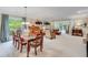 Spacious living and dining area featuring neutral tones, large windows, and hardwood dining set at 4460 Delano Dr, Cumming, GA 30040