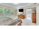 The spacious main bedroom features a tray ceiling, and access to the ensuite bathroom at 4460 Delano Dr, Cumming, GA 30040