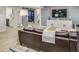 Finished basement boasts a spacious seating area with a large flatscreen television and modern decor at 1343 Peachtree Battle Nw Ave, Atlanta, GA 30327