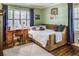 Comfortable bedroom includes a stylish daybed with a desk, a Georgia Tech blanket, and natural light at 1343 Peachtree Battle Nw Ave, Atlanta, GA 30327