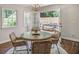 Inviting dining area with charming chandelier and easy access to outdoor patio through French doors at 1343 Peachtree Battle Nw Ave, Atlanta, GA 30327