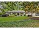 Charming single-story home with manicured front lawn and thoughtfully designed landscaping at 1343 Peachtree Battle Nw Ave, Atlanta, GA 30327