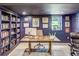 Stylish office boasts built-in bookshelves, natural light, and professional decor perfect for working from home at 1343 Peachtree Battle Nw Ave, Atlanta, GA 30327
