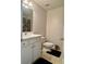 Cozy bathroom with white vanity, decorative fixtures, and neutral tile flooring for a clean and welcoming space at 19 Windcrest Dr, Covington, GA 30016