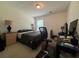 Well-lit bedroom featuring a desk, comfortable bed, and a window offering a serene workspace at 19 Windcrest Dr, Covington, GA 30016