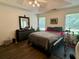 Relaxing bedroom retreat with a comfortable bed and lots of natural light at 19 Windcrest Dr, Covington, GA 30016