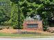 Windcrest neighborhood brick sign with manicured landscaping and mature trees at 19 Windcrest Dr, Covington, GA 30016
