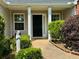Inviting front entrance with beautiful landscaping, stone walkway and plenty of curb appeal at 19 Windcrest Dr, Covington, GA 30016