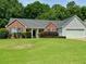 Charming brick home with well-maintained lawn and landscaping offering great curb appeal at 19 Windcrest Dr, Covington, GA 30016