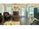Bright living room with lots of natural light and view of traditional fireplace at 19 Windcrest Dr, Covington, GA 30016