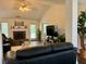 Spacious living room with fireplace, cozy seating, natural light, and tasteful décor for comfortable living at 19 Windcrest Dr, Covington, GA 30016