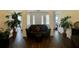 Spacious living room featuring wood floors, neutral walls, and comfortable seating arrangement at 19 Windcrest Dr, Covington, GA 30016
