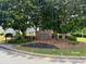 Welcoming neighborhood entrance sign with well-maintained landscaping at 19 Windcrest Dr, Covington, GA 30016