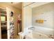 Relaxing soaking tub area with integrated storage at 2000 Redwood Trce, Ellenwood, GA 30294