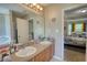 A primary bathroom features a double sink vanity, tile floors, and decorative wall art at 2000 Redwood Trce, Ellenwood, GA 30294