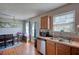 Traditional kitchen features a dining area, access to outdoor living space, and stainless steel appliances at 2000 Redwood Trce, Ellenwood, GA 30294