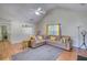 Cozy living room with vaulted ceilings, comfortable seating, and stylish decor, creating a welcoming atmosphere at 2000 Redwood Trce, Ellenwood, GA 30294
