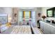 Bright main bedroom with a crib, dresser, stylish decor, and natural light at 2000 Redwood Trce, Ellenwood, GA 30294