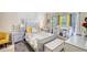 Beautiful main bedroom features stylish furniture, neutral colors, and a coordinated crib and baby decor at 2000 Redwood Trce, Ellenwood, GA 30294