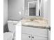 Clean white bathroom with stone countertop and white modern sink at 2814 Lloyd Rd, Decatur, GA 30034