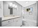 Renovated bathroom with white marble tile, granite countertops, and modern fixtures at 2814 Lloyd Rd, Decatur, GA 30034