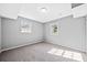 Cozy carpeted bedroom with a light gray walls, large windows providing plenty of natural light at 2814 Lloyd Rd, Decatur, GA 30034