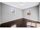 Bright bedroom features natural lighting, clean neutral paint, and dark wood flooring at 2814 Lloyd Rd, Decatur, GA 30034