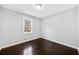 Empty bedroom with hardwood floors and a window providing natural light at 2814 Lloyd Rd, Decatur, GA 30034