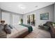 Cozy bedroom features soft carpet, neutral paint, and sliders out to deck at 2814 Lloyd Rd, Decatur, GA 30034