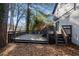 Exterior view of a spacious wood deck accessible from the home, with steps to the backyard at 2814 Lloyd Rd, Decatur, GA 30034