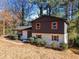 Two-story home with brick exterior, modern paint, complemented by mature trees in a serene setting at 2814 Lloyd Rd, Decatur, GA 30034