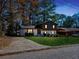 Charming two-story home featuring a well-maintained front yard, fresh landscaping, and a private driveway at 2814 Lloyd Rd, Decatur, GA 30034