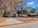 Charming split-level home featuring freshly painted brick and attractive landscaping at 2814 Lloyd Rd, Decatur, GA 30034